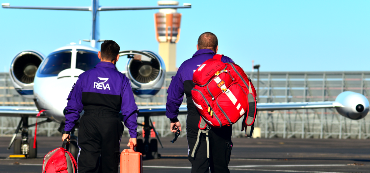 air ambulance crew walking towards plane